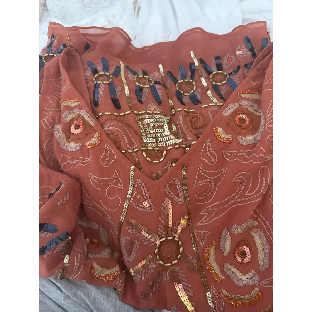 Free People coral tunic dress features intricate gold and blue sequin Size small